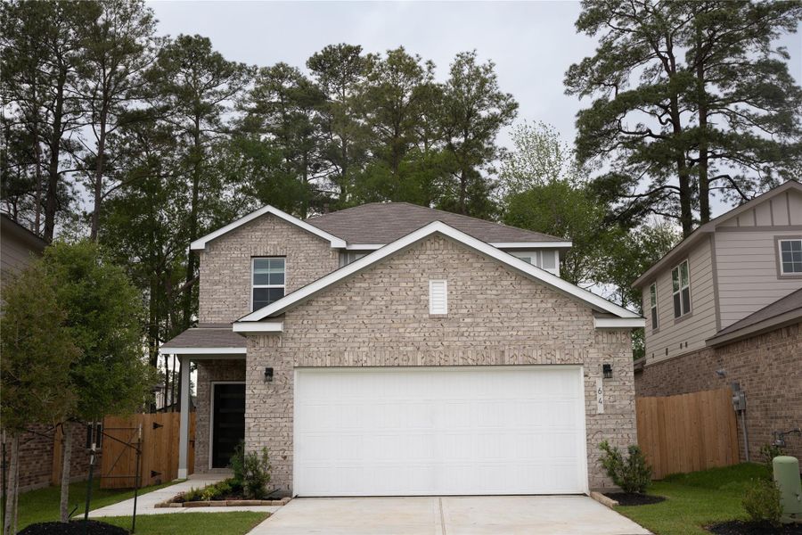 Front exterior of a new home in Lakes at Black Oak, Magnolia, TX, highlighting curb appeal (Image 16).