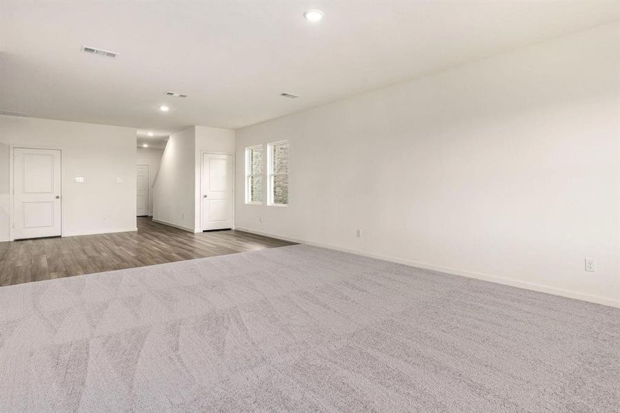 Spare room with carpet flooring and recessed lighting Spare room with carpet flooring and recessed lighting