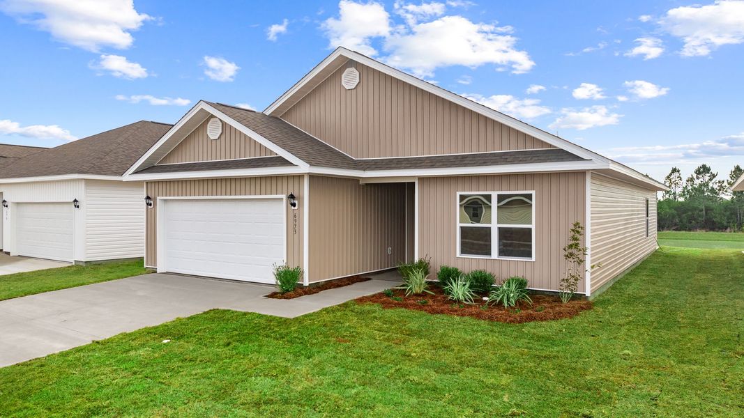 Front exterior of a new home in Liberty, Panama City, FL, highlighting curb appeal (Image 18).