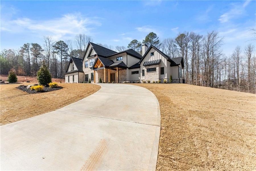 Front exterior of a new home in , Hoschton, GA, highlighting curb appeal (Image 34). Front exterior of a new home in , Hoschton, GA, highlighting curb appeal (Image 34).