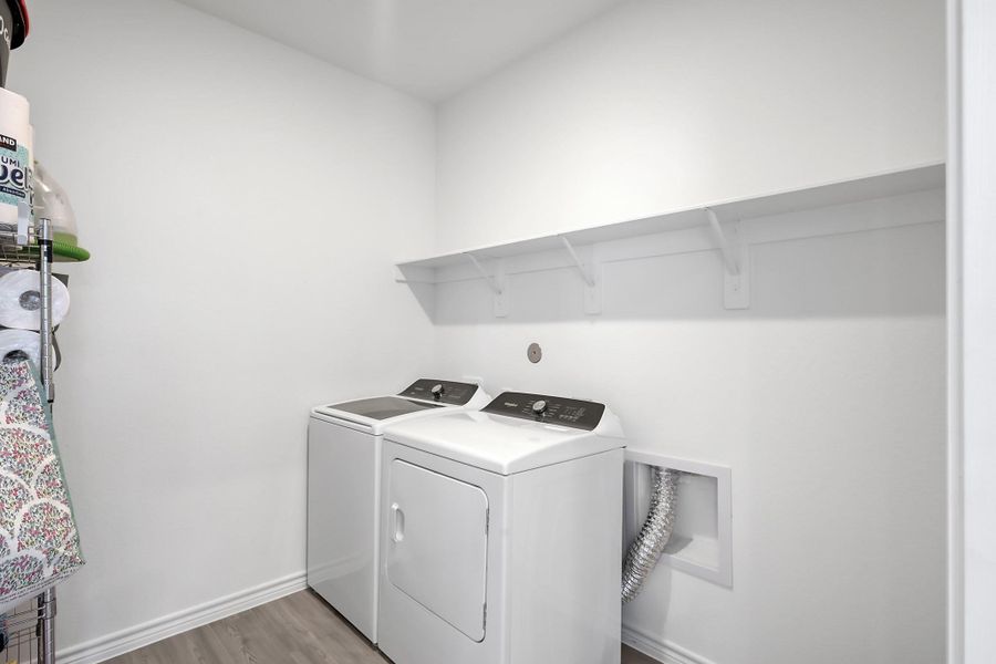 View of the laundry room. Good news, washer & dryer are included.