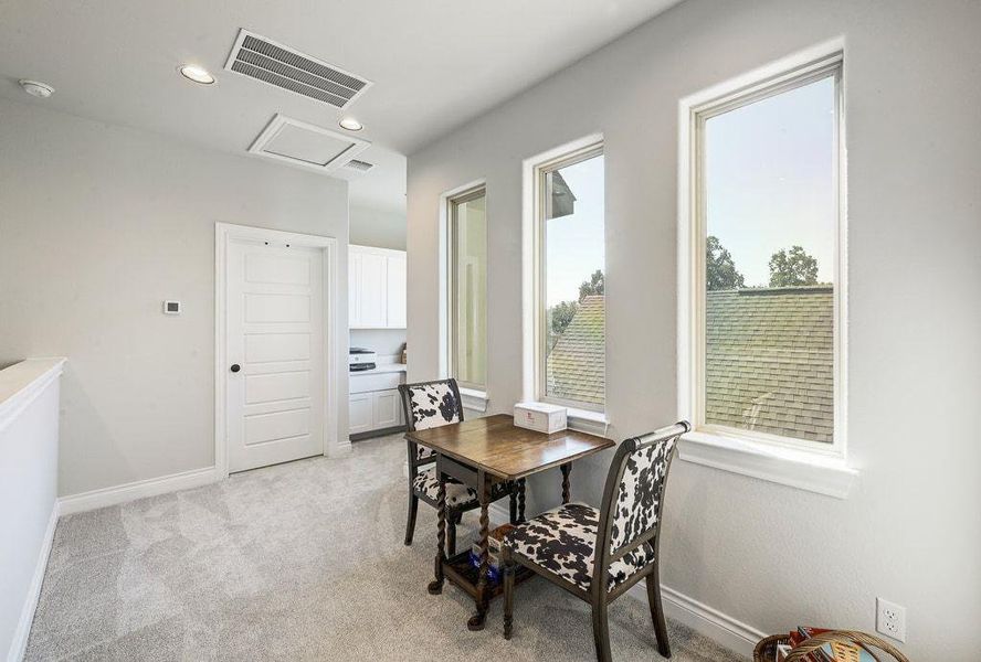 Upstairs landing with room for a game table/small living area Upstairs landing with room for a game table/small living area