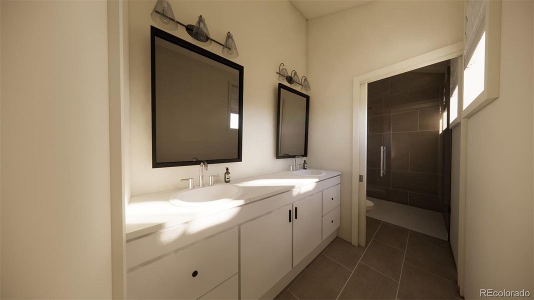 Double sinks and separate room for toilet and shower. *This is a 3D rendering.