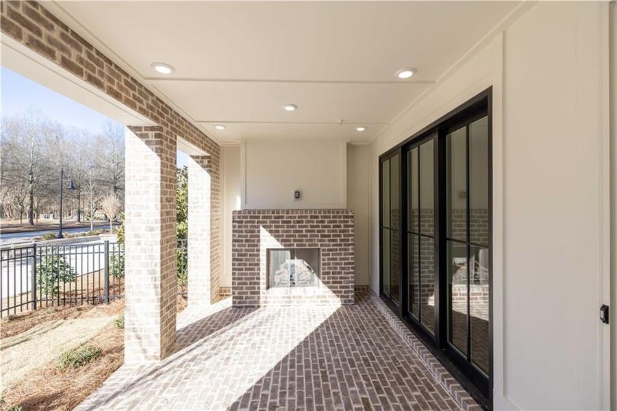 Enjoy crisp fall evenings on the covered patio with cozy fireplace.