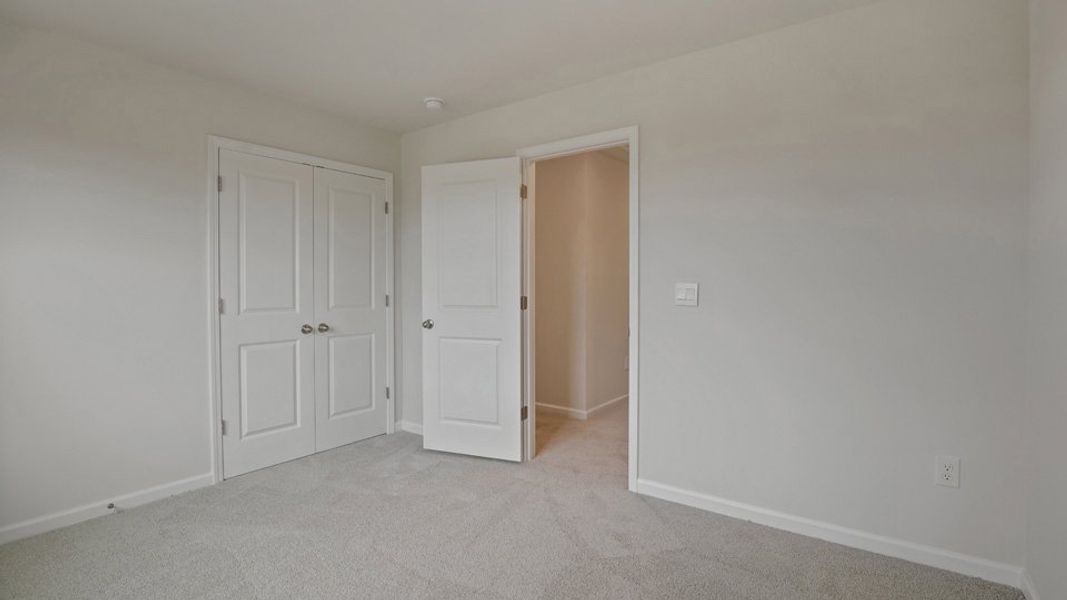 Spacious, unfurnished interior of a new home in The Grove at Matthews Landing, Fuquay Varina (Image 23).