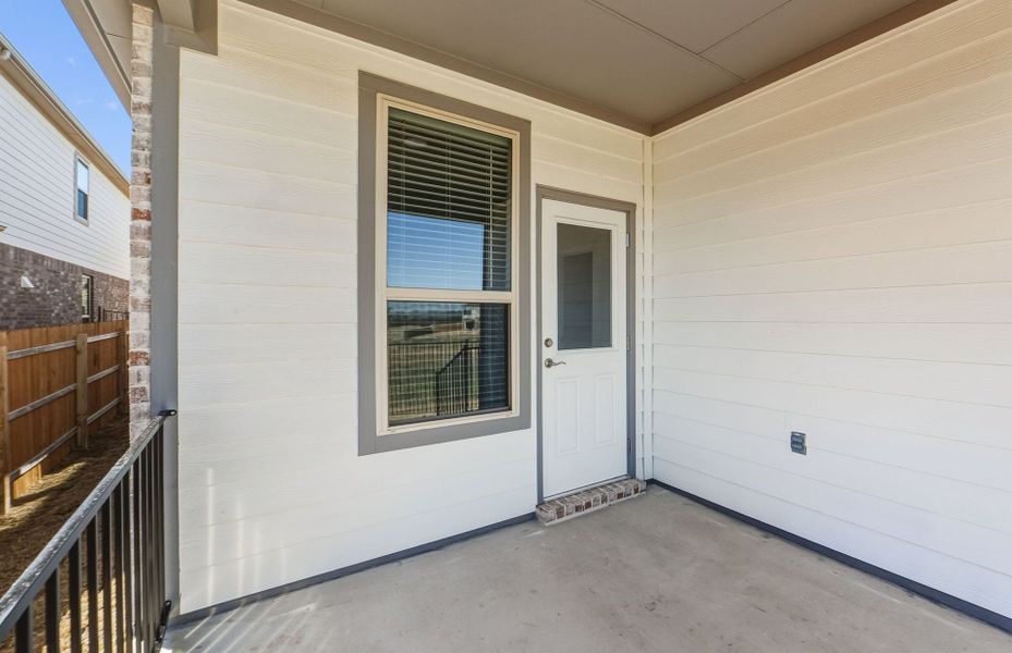 Exterior details and patio area of a home in Saddleback at Santa Rita Ranch, Liberty Hill (Image 26).