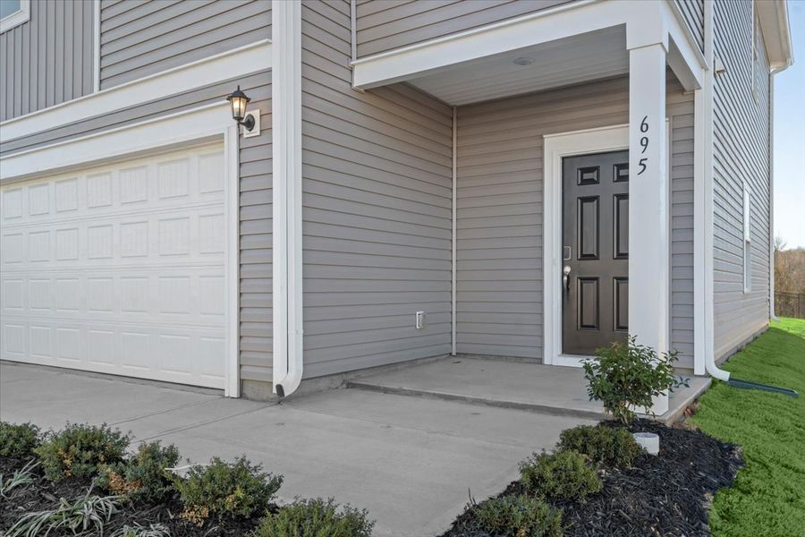 Exterior details and patio area of a home in Creek Ridge - Heritage Collection, Spartanburg (Image 2). Exterior details and patio area of a home in Creek Ridge - Heritage Collection, Spartanburg (Image 2).