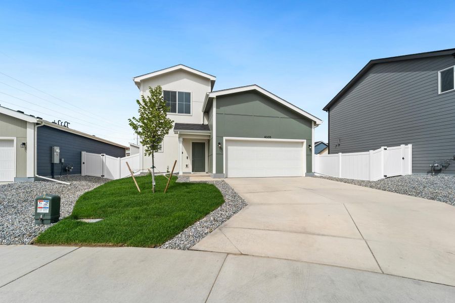 Front exterior of a new home in Liberty Draw, Evans, CO, highlighting curb appeal (Image 28).