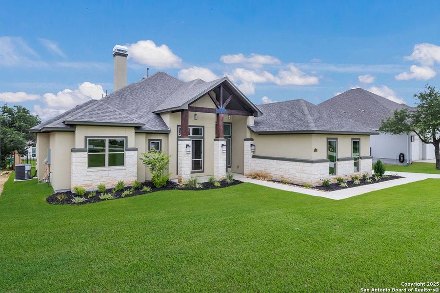 Front exterior of a new home in Johnson Ranch, Bulverde, TX, highlighting curb appeal (Image 19). Front exterior of a new home in Johnson Ranch, Bulverde, TX, highlighting curb appeal (Image 19).