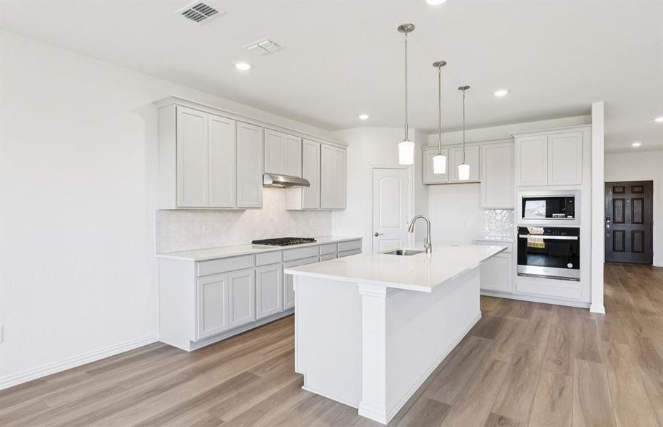 Spacious kitchen with eat-in bartop island Spacious kitchen with eat-in bartop island