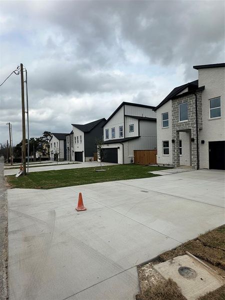 Front exterior of a new home in , Dallas, TX, highlighting curb appeal (Image 17).