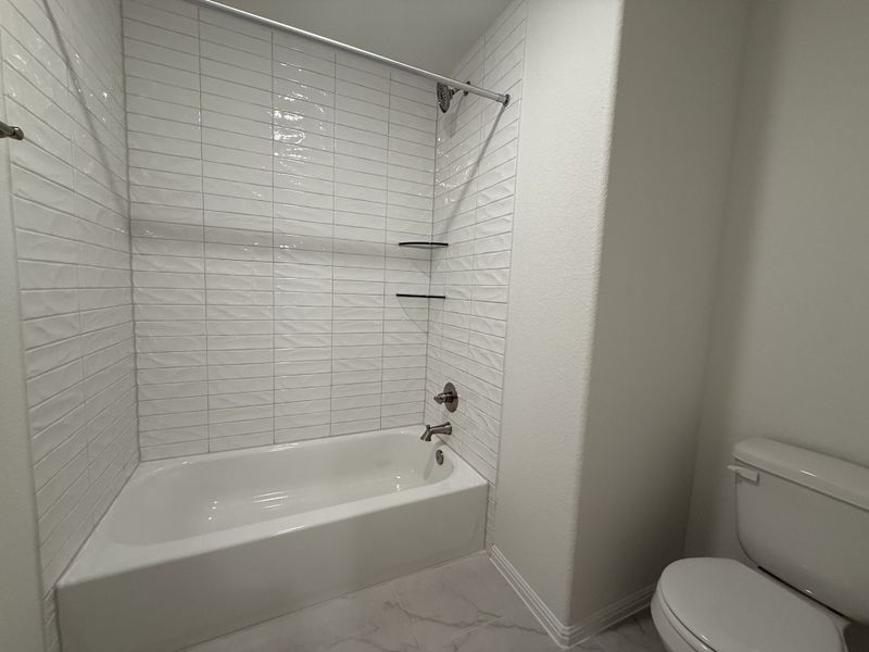 Furnished interior view inside a new home in The Hills of Bear Creek, Austin (Image 17).
