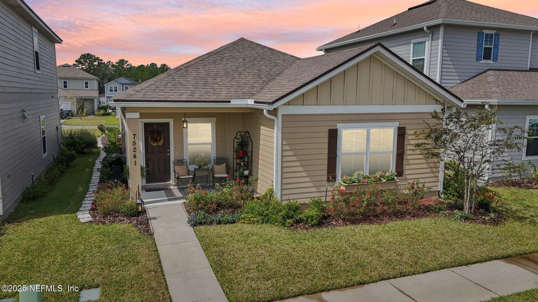 Front exterior of a new home in Tributary, Yulee, FL, highlighting curb appeal (Image 20). Front exterior of a new home in Tributary, Yulee, FL, highlighting curb appeal (Image 20).