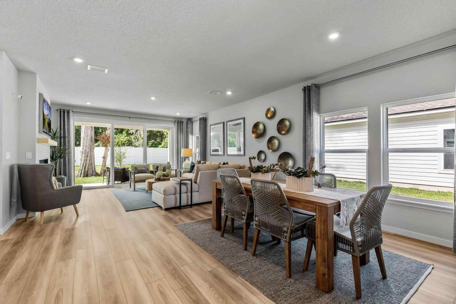 A large dining room with a large table and chairs.