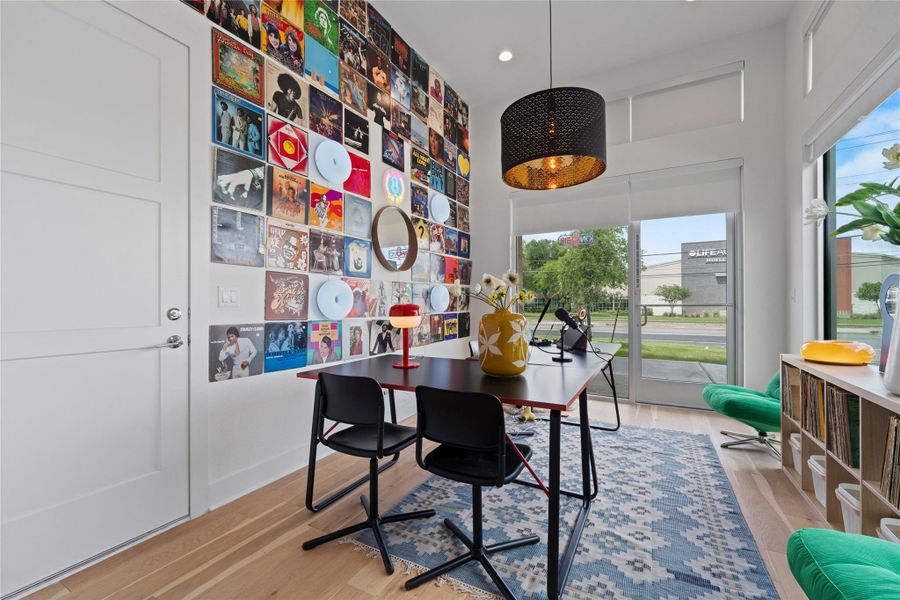 Contemporary interior featuring wood-finish flooring and a full-light glass door
