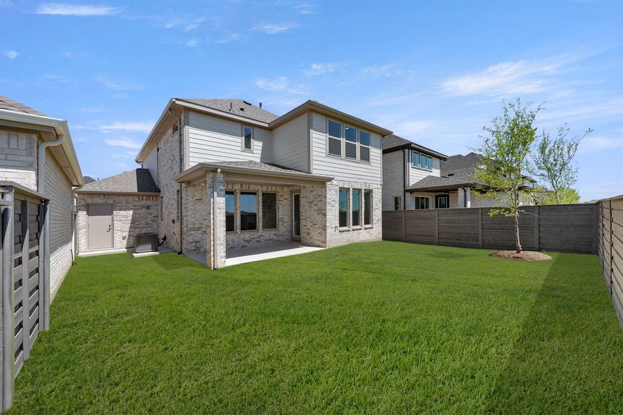 Exterior details and patio area of a home in Union Park, Little Elm (Image 3).