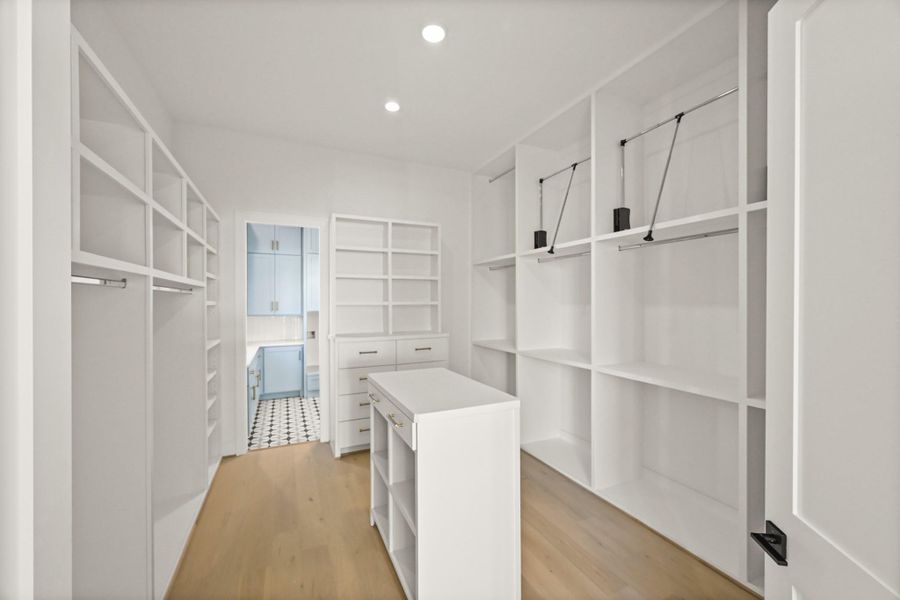 The master closet offers triple height hanging and direct access to the laundry room!
