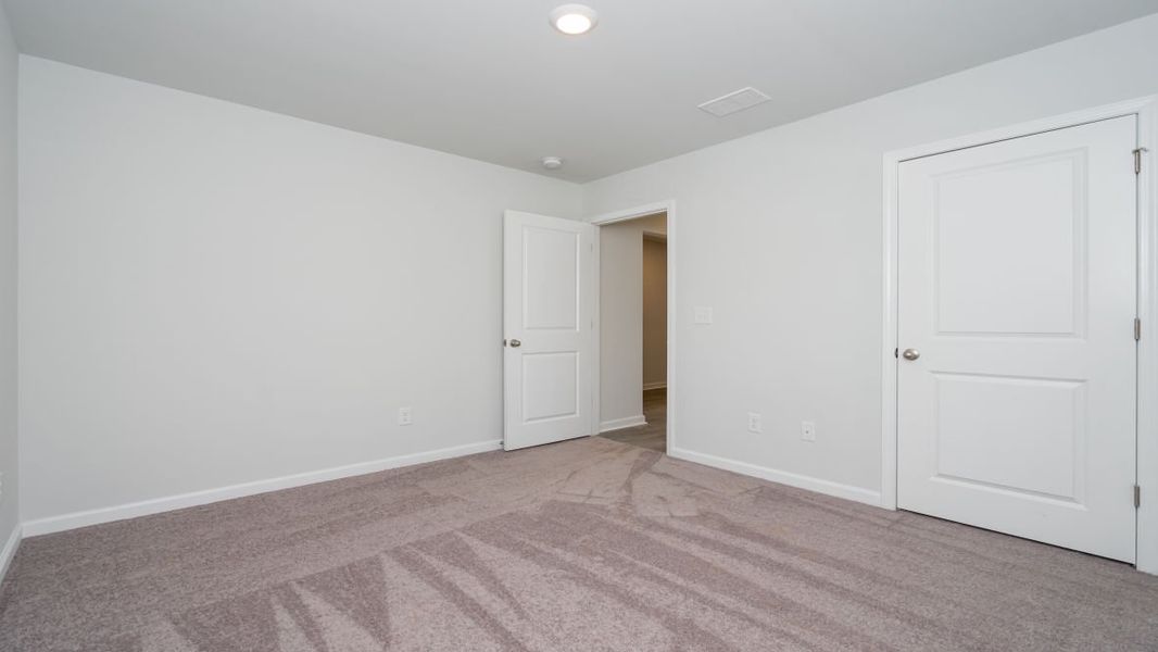 Representative unfurnished interior of a home built from the ARIA by D.R. Horton in Stanbury Creek, Supply (Image 13).