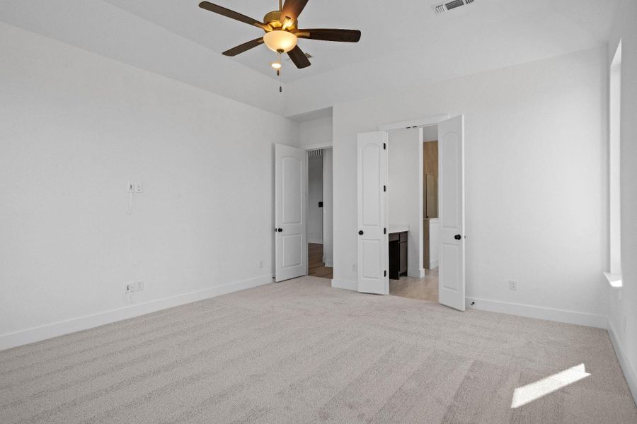 Primary Bedroom with elevated ceiling Primary Bedroom with elevated ceiling