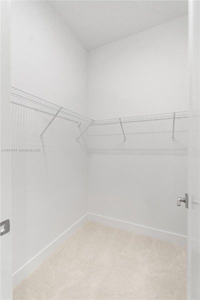 Primary walk-in closet 1 of 2