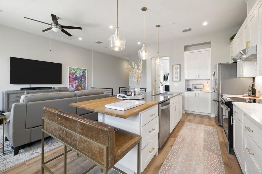 The island/breakfast bar can seat many guests. The island/breakfast bar can seat many guests.