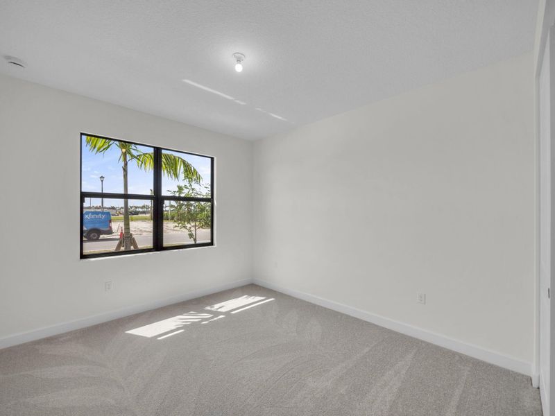 Spacious, unfurnished interior of a new home in Valencia Parc at Riverland, Port St. Lucie (Image 24).