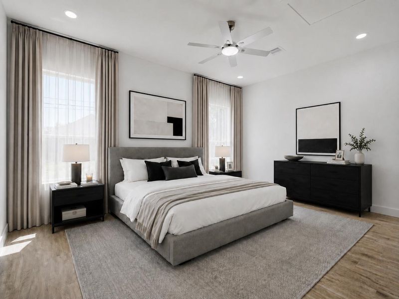 The downstairs primary suite offers recessed lighting, wood-look tile flooring, and a grand en-suite bath. (Virtually staged) The downstairs primary suite offers recessed lighting, wood-look tile flooring, and a grand en-suite bath. (Virtually staged)