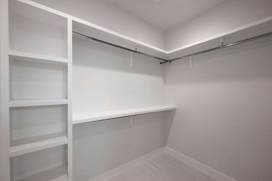 Walk in closet featuring light tile patterned floors