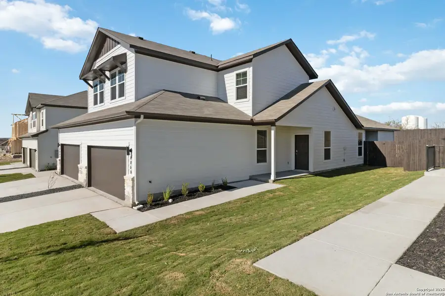 Front exterior of a new home in Emma Park, Buda, TX, highlighting curb appeal (Image 2). Front exterior of a new home in Emma Park, Buda, TX, highlighting curb appeal (Image 2).