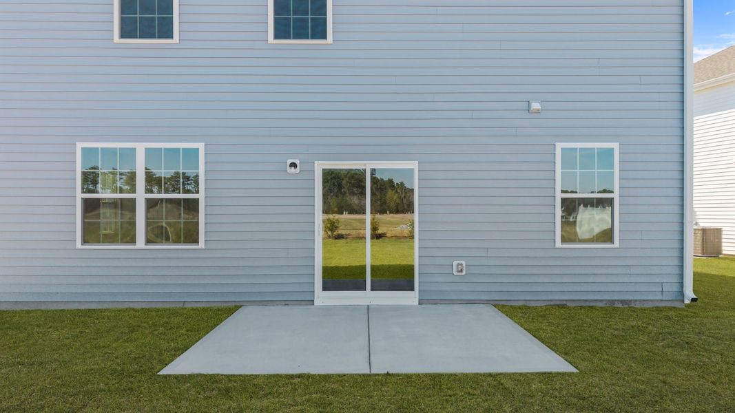 Exterior details and patio area of a home in Ridgewood Farms, Winterville (Image 17).