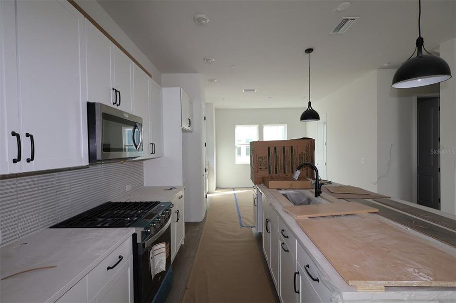 In-progress construction of a new home in Towns at Union, St. Petersburg, FL (Image 12).