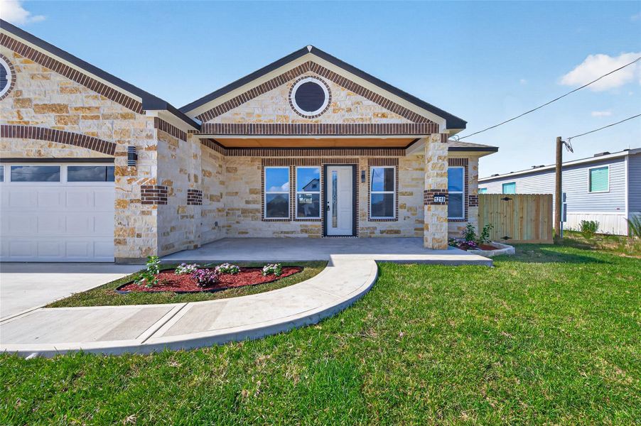 Custom single-story home featuring a welcoming front porch, attractive curb appeal, and quality exterior finishes. Custom single-story home featuring a welcoming front porch, attractive curb appeal, and quality exterior finishes.