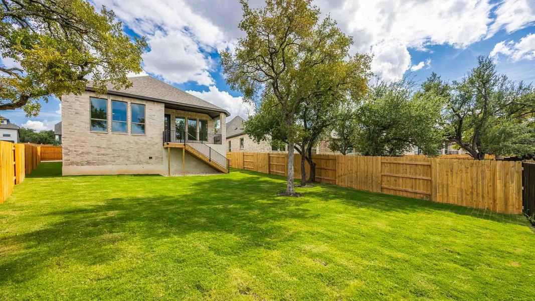 Fenced backyard with a sunroom Fenced backyard with a sunroom