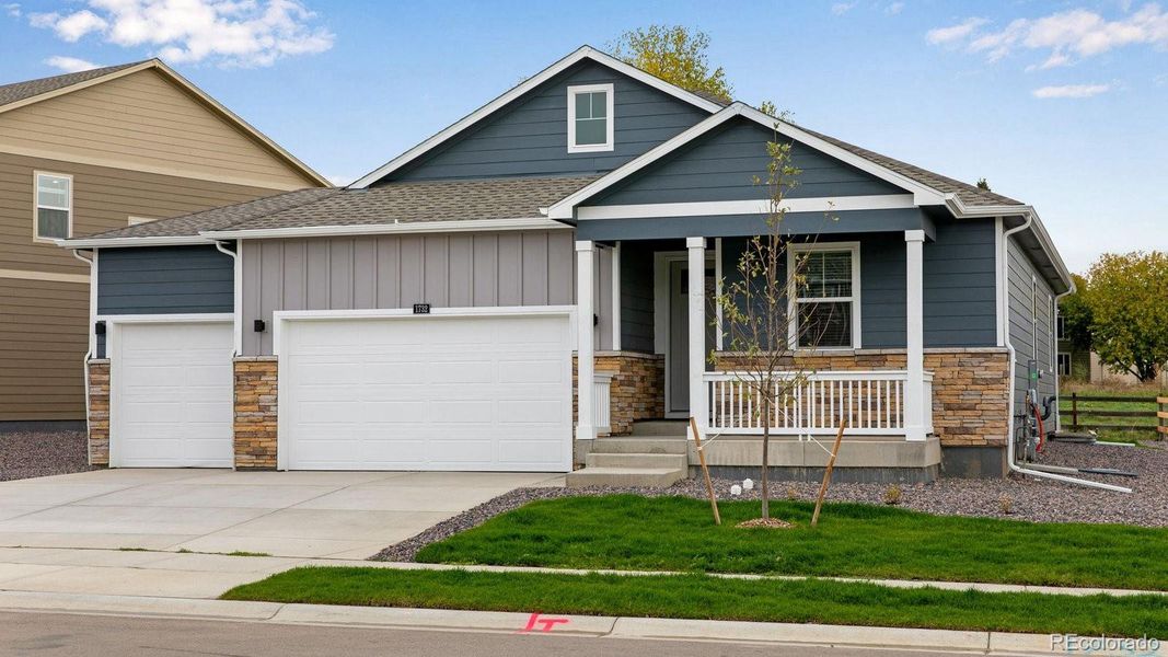 Front exterior of a new home in Hansen Farm, Fort Collins, CO, highlighting curb appeal (Image 2).