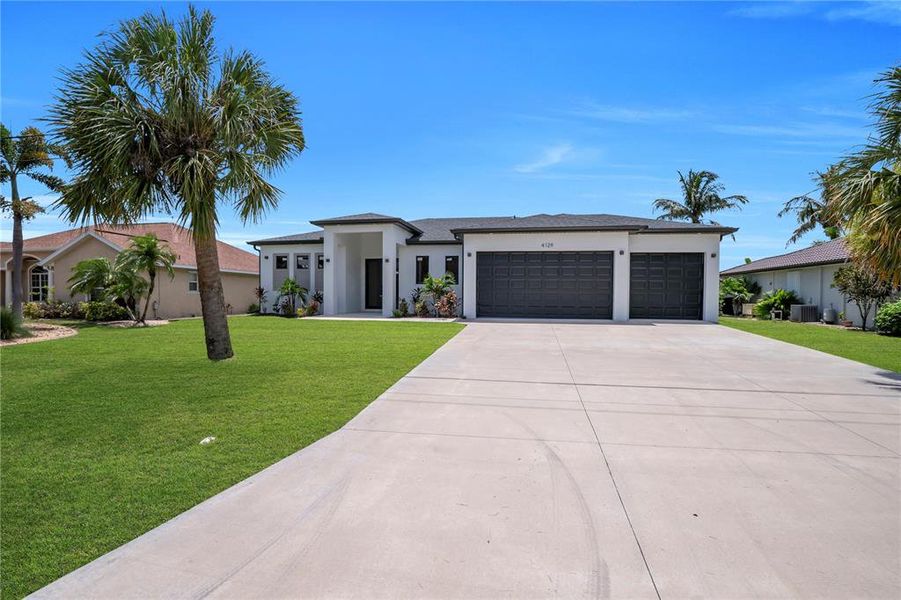 Front exterior of a new home in , Port Charlotte, FL, highlighting curb appeal (Image 22). Front exterior of a new home in , Port Charlotte, FL, highlighting curb appeal (Image 22).