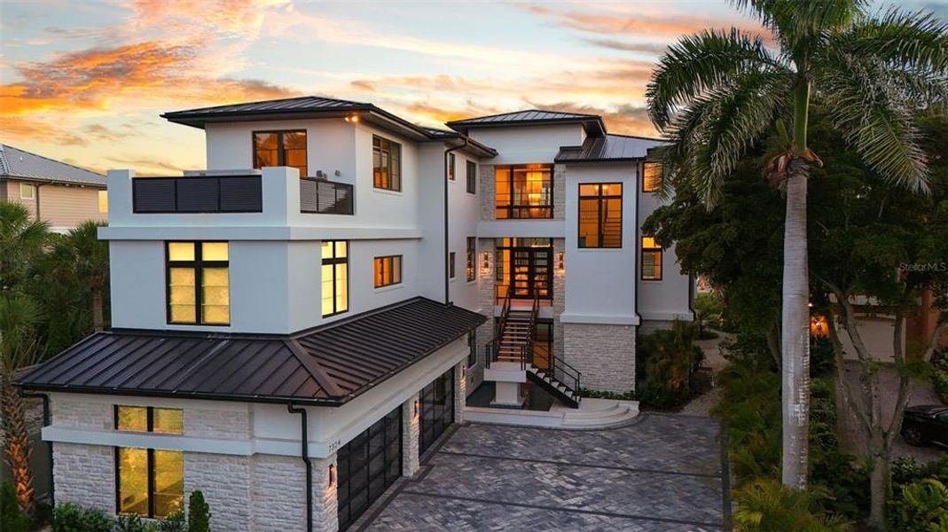 Front exterior of a new home in , Sarasota, FL, highlighting curb appeal (Image 25). Front exterior of a new home in , Sarasota, FL, highlighting curb appeal (Image 25).