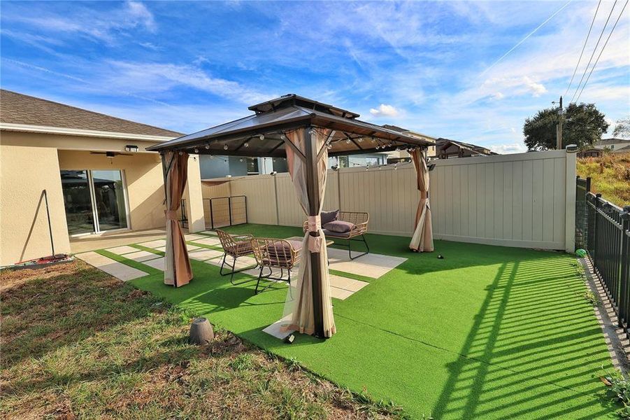 Exterior details and patio area of a home in Forest Lake, Davenport (Image 27).