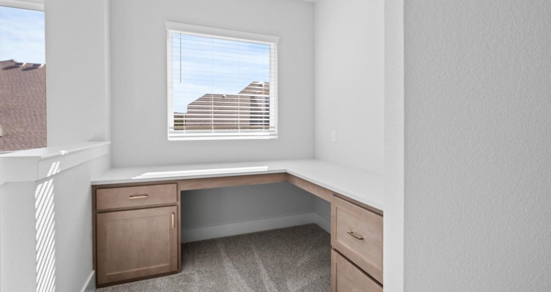 Representative furnished interior of a home built from the Raegan by Chesmar Homes in Sweetwater, Austin (Image 7).