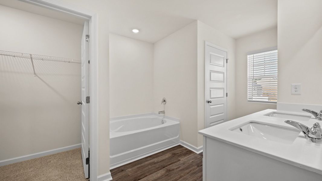 Representative furnished interior of a home built from the Salisbury by D.R. Horton in Inverness at Sugarloaf, Lawrenceville (Image 10).