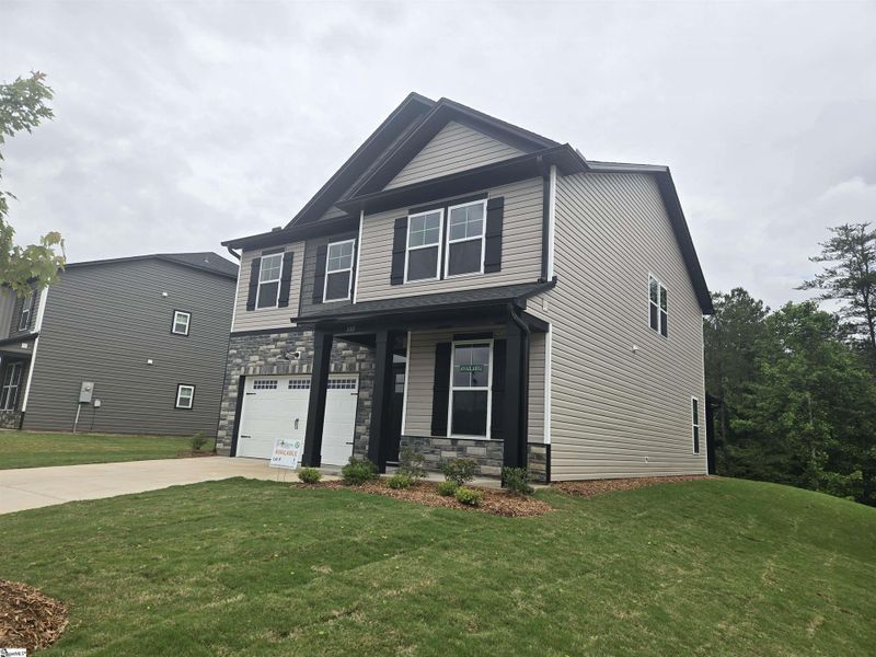 Front exterior of a new home in Shiloh Trail, Wellford, SC, highlighting curb appeal (Image 16). Front exterior of a new home in Shiloh Trail, Wellford, SC, highlighting curb appeal (Image 16).