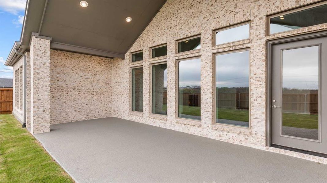 Exterior details and patio area of a home in Terraces 72', Rockwall (Image 4).