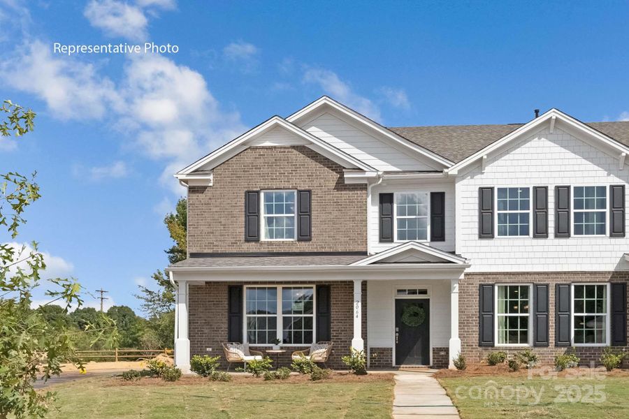 Front exterior of a new home in Sanctuary at Southgate, Indian Trail, NC, highlighting curb appeal (Image 1).