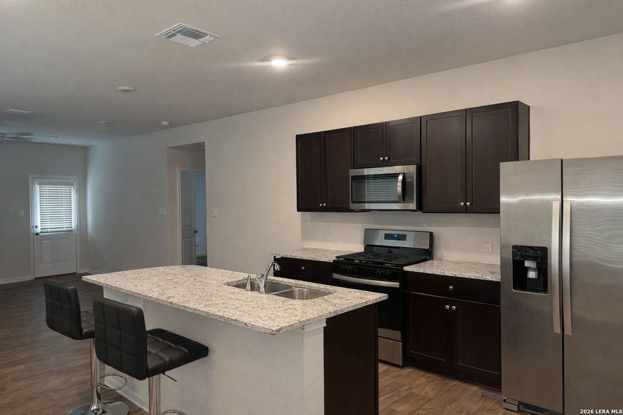 Furnished interior view inside a new home in Avenida, Converse (Image 5).
