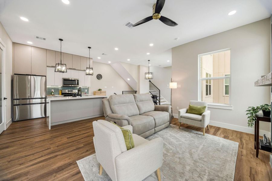 Open and airy living space with soaring ceilings, recessed lighting, and abundant natural light. Open and airy living space with soaring ceilings, recessed lighting, and abundant natural light.