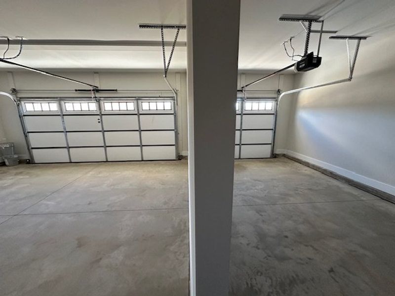 This spacious garage offers ample parking with con
