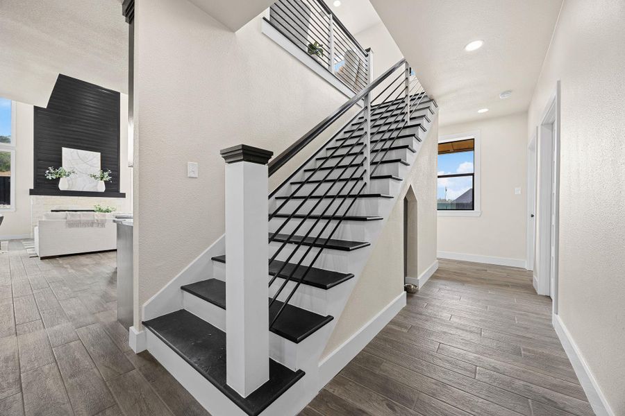 Stairs with wood finished floors and recessed lighting Stairs with wood finished floors and recessed lighting