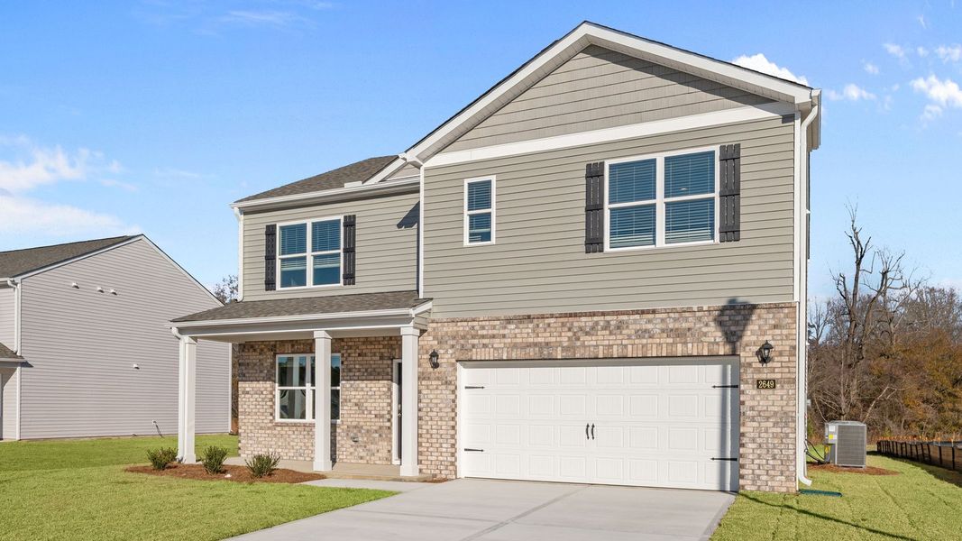 Front exterior of a new home in Villa Grande, Winterville, NC, highlighting curb appeal (Image 20).