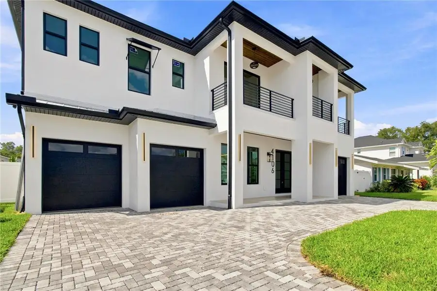 Front exterior of a new home in , Tampa, FL, highlighting curb appeal (Image 30).