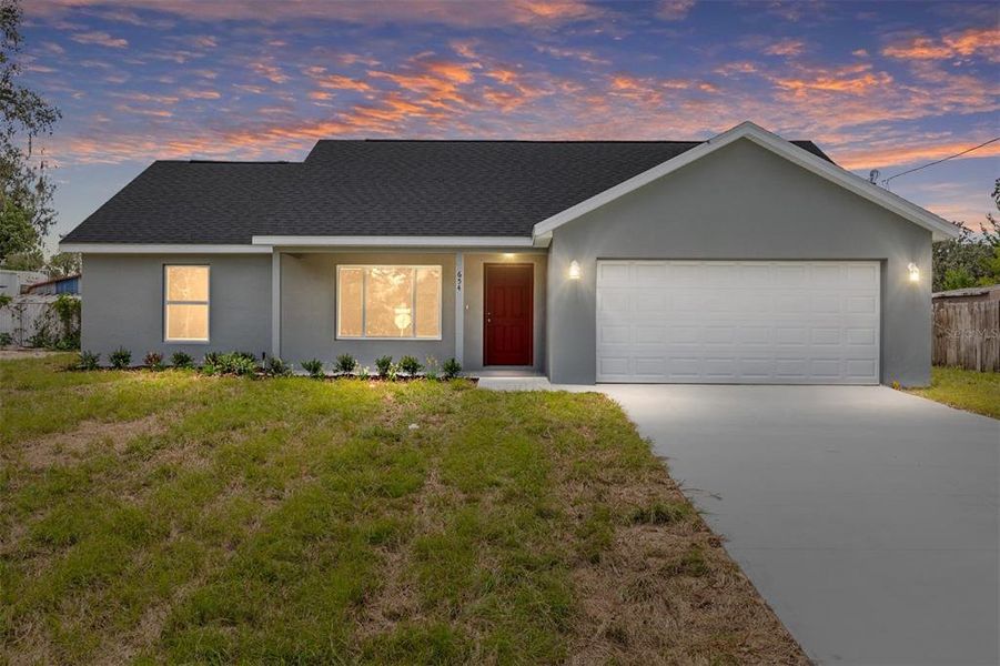 Front exterior of a new home in , Dunnellon, FL, highlighting curb appeal (Image 1).