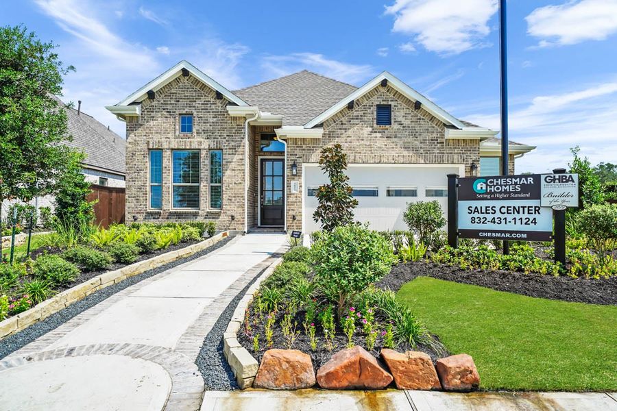 Front exterior of a new home in The Trails, New Caney, TX, highlighting curb appeal (Image 24).